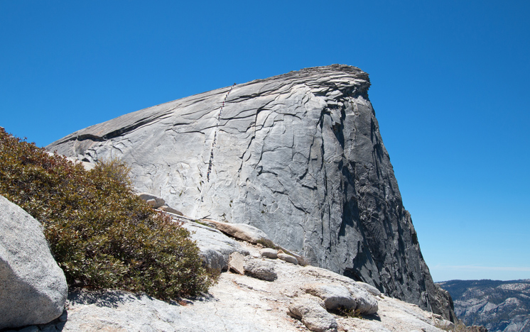 Cables with climbers on Half Dome as seen from the Sub Dome in Yosemite National Park